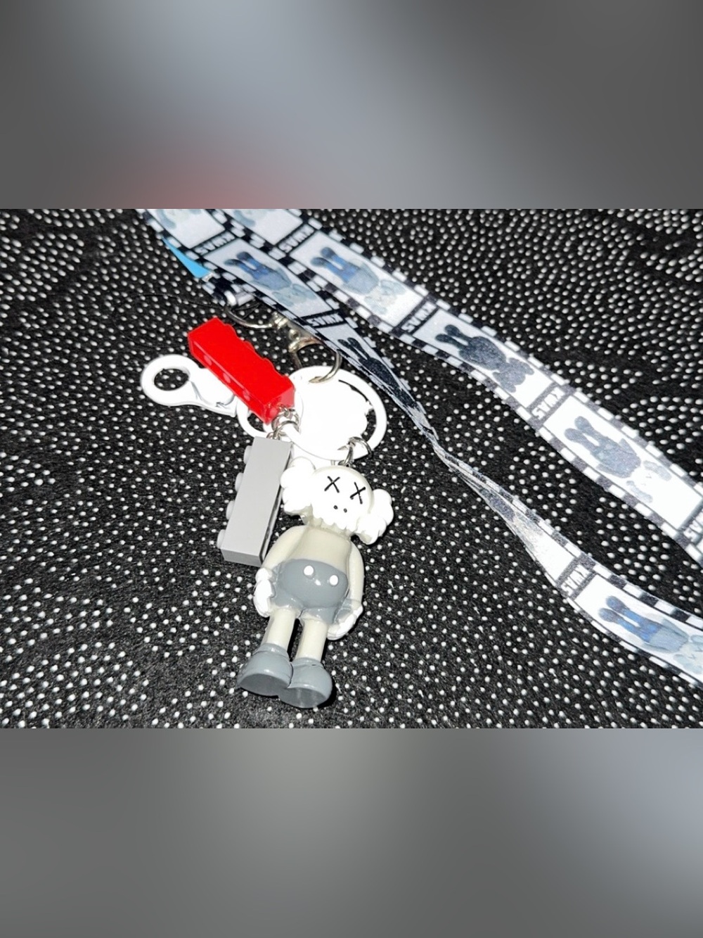 Gray & White KAWS-Inspired Character Keychain with Red Accent